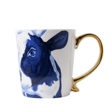 Mok met een goud oor en Delfts blauwe koe